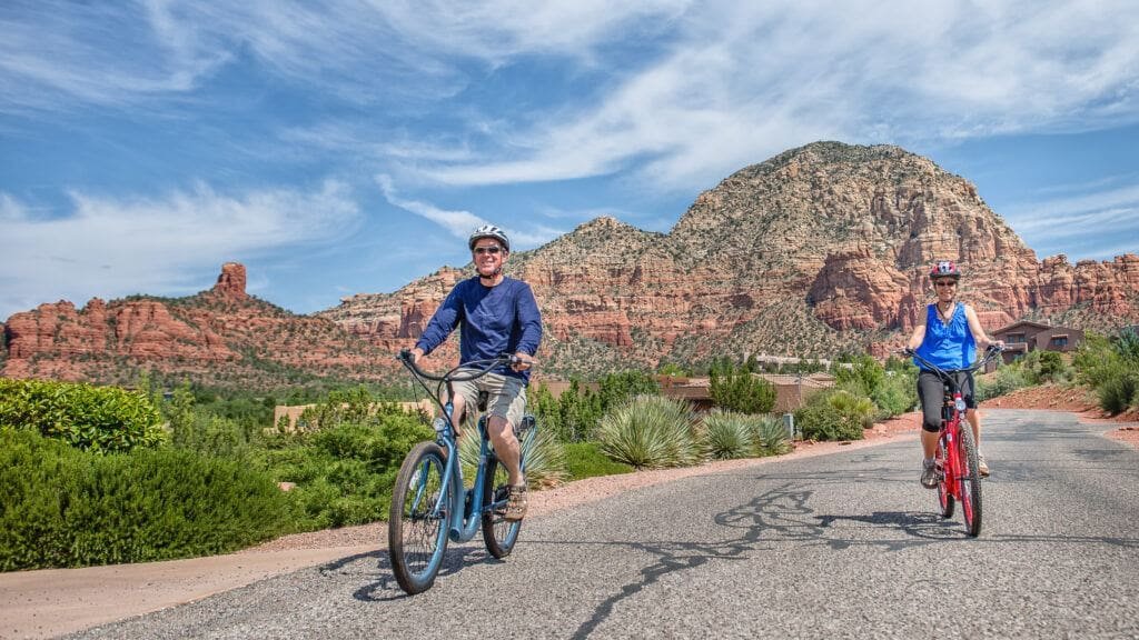 A couple enjoying a ride on their Pedego Electric Bikes