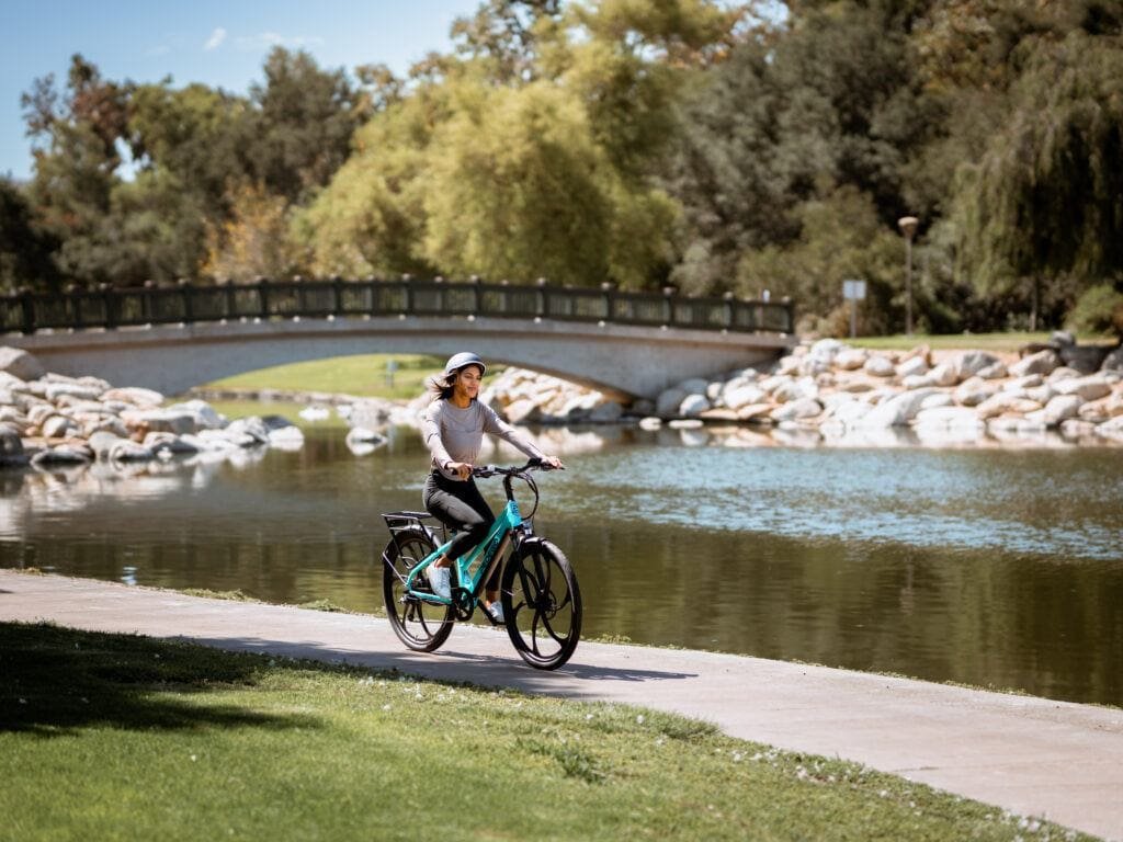 Wpman enjoying a ride on her Pedego Avenue Electric Bike along the river